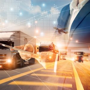Businessman using tablet on logistic network distribution and smart transportation and networking intelligent logistics of truck and train container cargo ship, Logistic import export and industry.